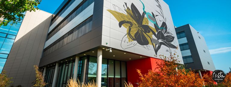 Monumental exterior plant fresco on the façade of a building – health and laboratory.